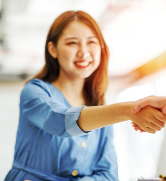 pharmacist smiling at customer at the counter